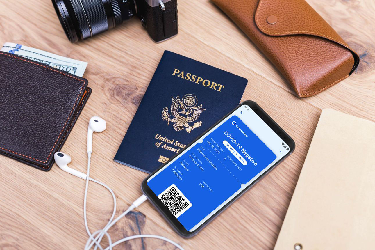 Picture of passport and mobile phone with COVID test results